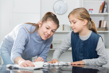 Fototapeta premium Mother and daughter cleans the house. High quality photo