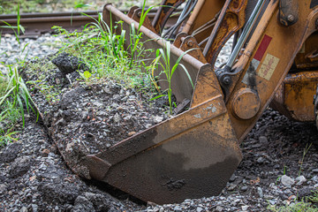 Close up of the bucket of a front end loader.