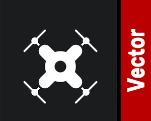 White Drone flying icon isolated on black background. Quadrocopter with video and photo camera symbol. Vector Illustration.