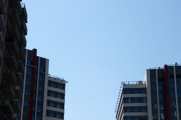 Fototapeta premium Rooftops of residential buildings. Balconies and terraces at the multistorey houses.