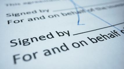 Business person signing contract. Worker signing document with ballpen