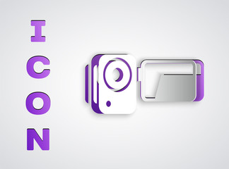 Paper cut Cinema camera icon isolated on grey background. Video camera. Movie sign. Film projector. Paper art style. Vector Illustration.