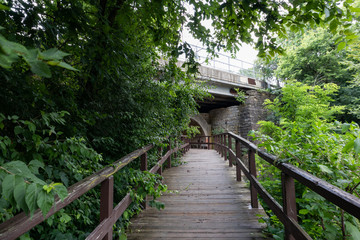 Walkway and Tunnel by the Ruins of the Old Dam at Dellwood Park in Lockport Illinois during the Summer