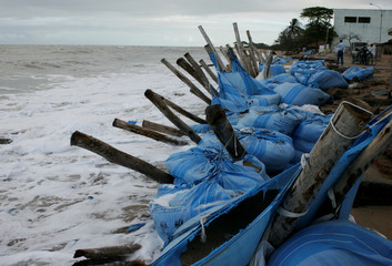 mucuri, bahia / brazil - august 25, 2009: containment made of a sandbag to prevent the sea from...