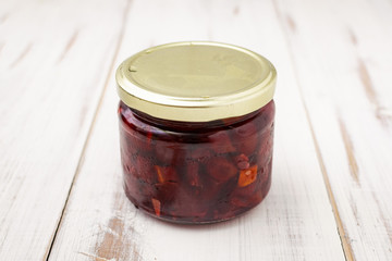 Product, vegetable pasta in a glass jar on a light wooden background.