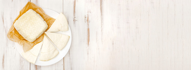 Homemade cottage cheese, cheese. Milk products. Place to insert text. Light wooden background.