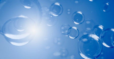 Bubbles Abstract Background. Group of Blue Soap Bubbles Float In The Dark.