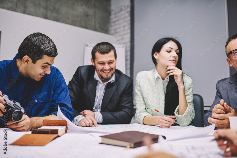 Aufkleber positive male and female engineers discussing productive strategy of creating architectural project 