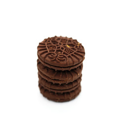 Close-Up Stack Of Chocolate Biscuits Against White Background