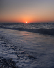 Fototapeta na wymiar Epischer und dramatischer Sonnenuntergang als Langzeitbelichtung