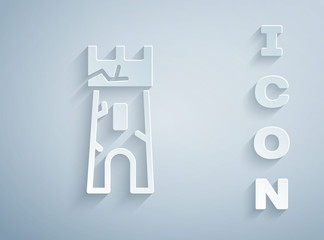 Paper cut Castle tower icon isolated on grey background. Fortress sign. Paper art style. Vector.
