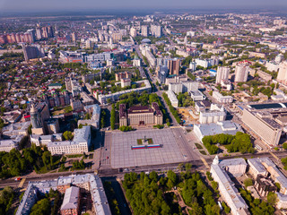 Fototapeta na wymiar View from drone of residential areas and center of Voronezh city with Lenin Square, Russia