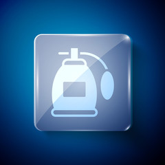 White Perfume icon isolated on blue background. Square glass panels. Vector.