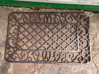 An old wrought iron doormat somewhere in Poland
