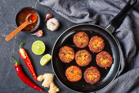 fried thai fish cakes on a skillet