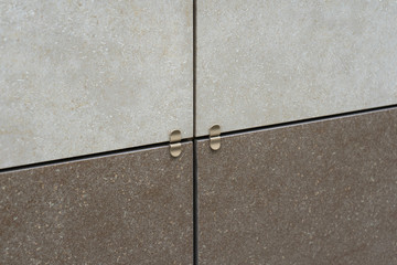 Fragment of a ventilated facade made of ceramic tile