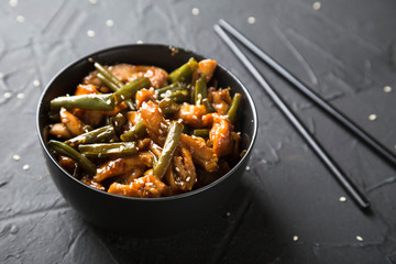 Fried green beans with chicken fillet in teriyaki sauce