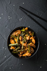 Fried green beans with chicken fillet in teriyaki sauce