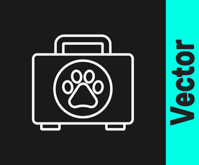 White line Pet first aid kit icon isolated on black background. Dog or cat paw print. Clinic box. Vector.