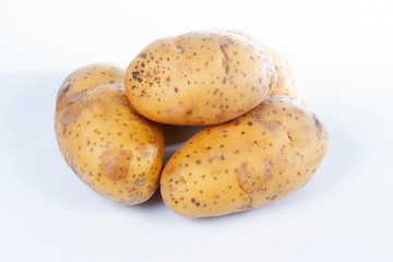 Unpeeled raw potatoes