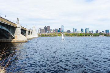 Sailboat in the Charles River with the Boston skyline and city in the background