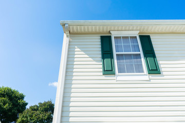 Residential home in neighborhood background theme showing the vinyl siding on the house exterior
