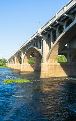 Vertical view of tall bridge over rushing waters in Columbia SC