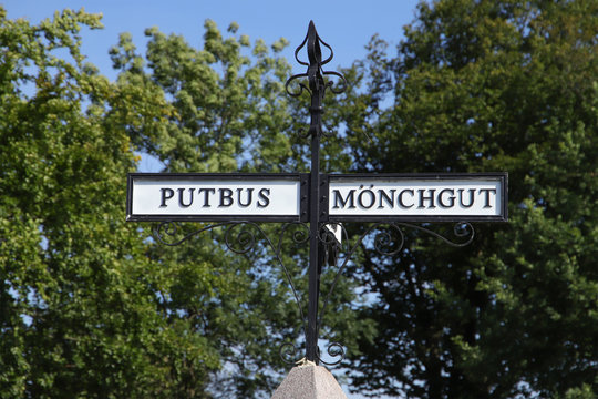 A sign post to city of putbus and peninsula M&ouml;nchgut, island R&uuml;gen, Germany