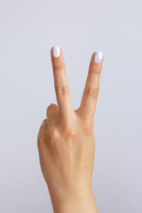 The hand shows the number two. Countdown gesture or sign. Sign language