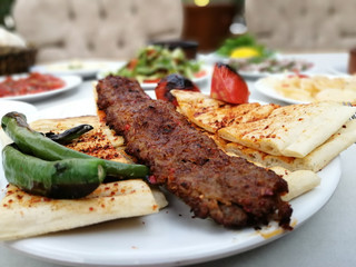 delicious Adana kebab and salads