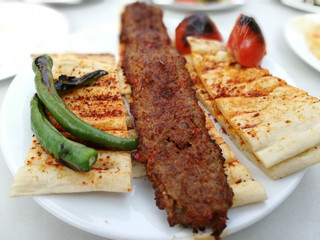 delicious Adana kebab and salads