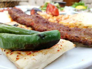 delicious Adana kebab and salads