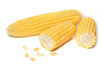 The peeled ear of corn, a piece of and seeds on a white, isolated