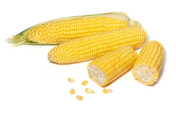 The peeled ear of corn, a piece of and seeds on a white, isolated