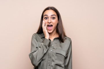 Young girl over isolated background with surprise and shocked facial expression