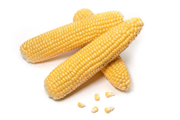 The peeled ear of corn, a piece of and seeds on a white, isolated