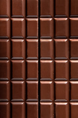 Pure chocolate bars, looking especially delicious. they are squared blocks shaped