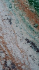 Abstract White, Turquoise, and Orange Natural Rocky Spring