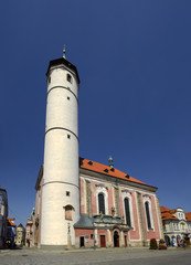 Domazlice, Czech Republic - Tower of the Church of the Nativity of the Virgin Mary in the Peace Square at the center of the town. - obrazy, fototapety, plakaty