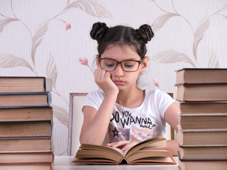 schoolgirl read book, young girl bored and tired of reading book at home. bored focused brainy girl nerd reading book learning grammar preparing final year exam test . tired . glasses. idea, think