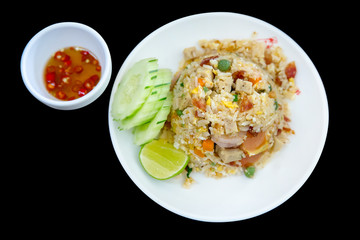 Flat lay photography of the Vietnamese fried rice on white plate on black background