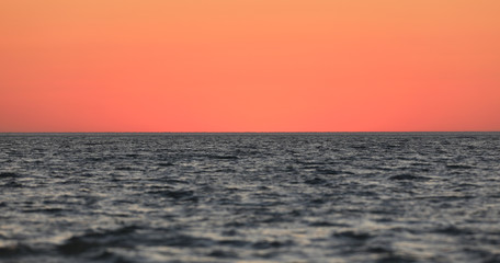 colorful sea sunset and orange sun