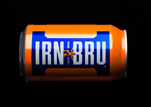 LONDON, UK - MARCH 15, 2017: Can of Irn-Bru lemonade soda drink on black. Produced by Barr in Scotland, UK