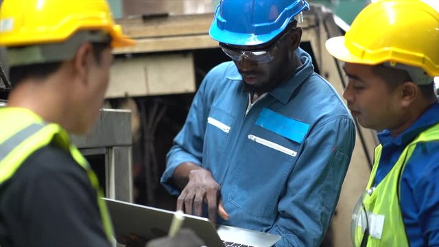 Slow motion, Engineer Black man and Technicians Asian man male worker working in factory area line up 