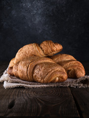 fresh croissant on a wooden table