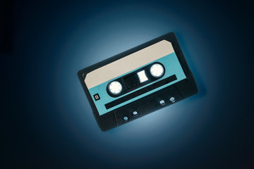 Audio cassette on blue background