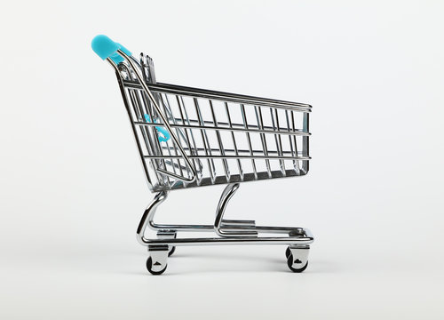 Retail shopping cart over white background