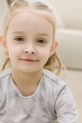 Fototapeta premium Happy little girl on close up portrait photo.