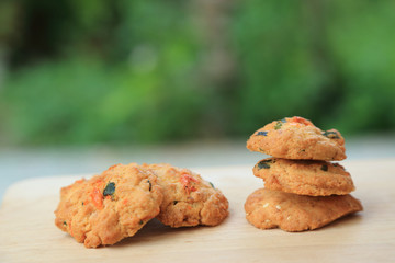 Dried shrimps cookies, Thai style homemade cookies, on blurred natureral green garden background.