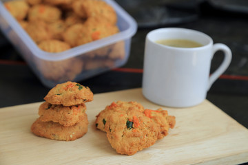 Dried shrimps cookies, Thai style homemade cookies, and white cup of coffee.